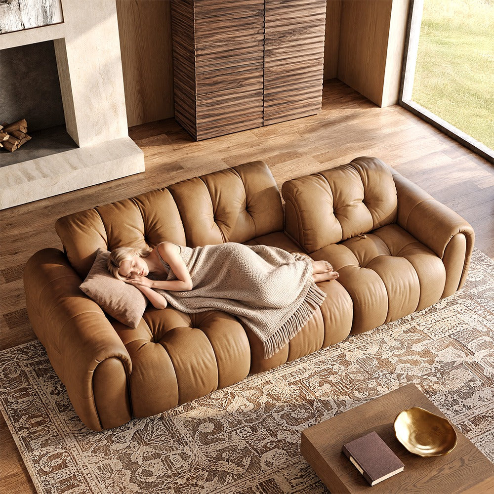 119.5-inch brown top-grain leather tufted modular sofa in a living room