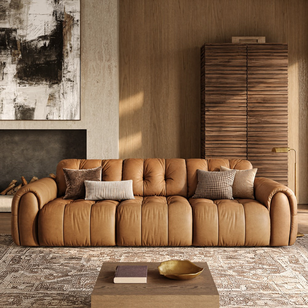119.5-inch brown leather tufted sofa in a living room, front view