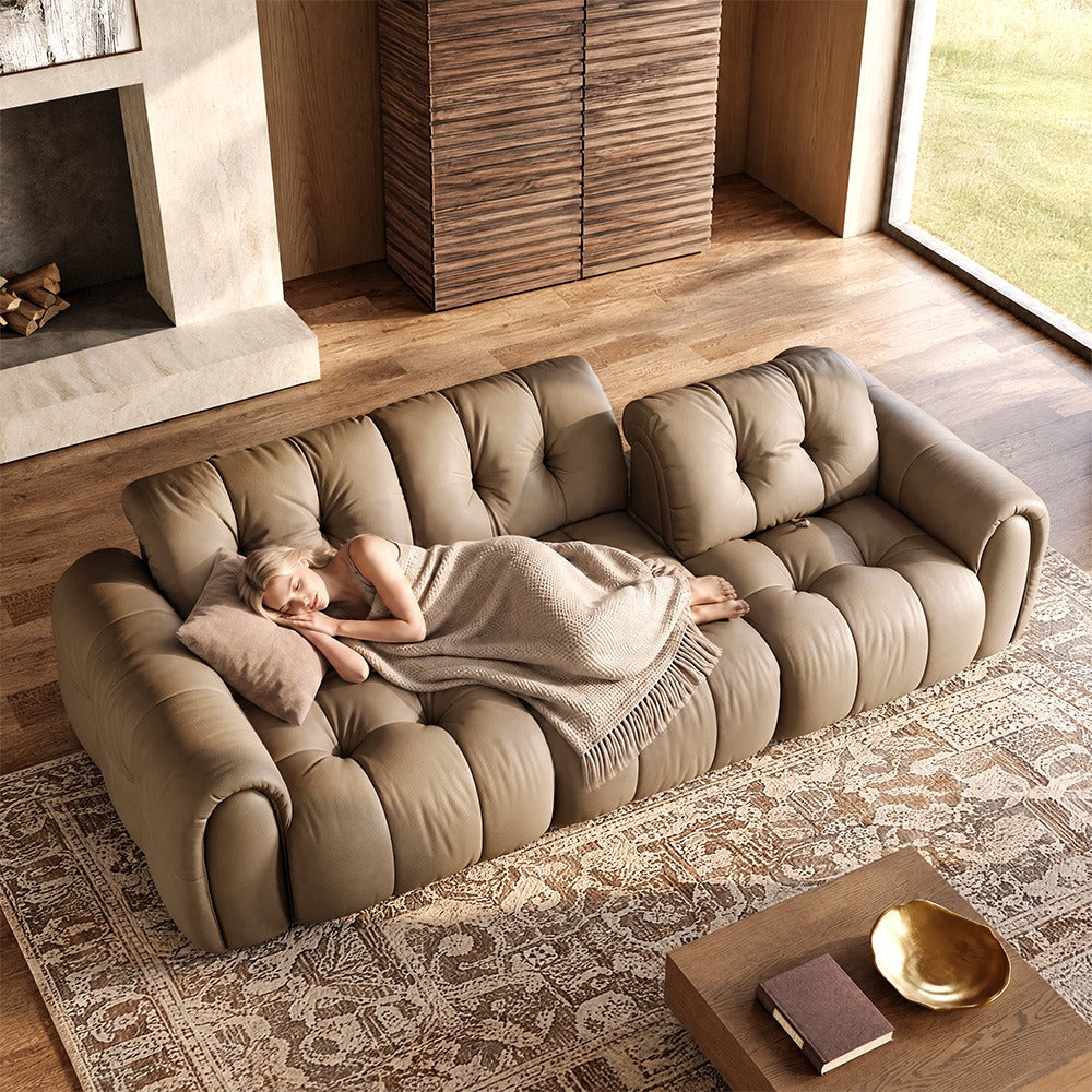 119.5-inch khaki top-grain leather tufted modular sofa in a living room