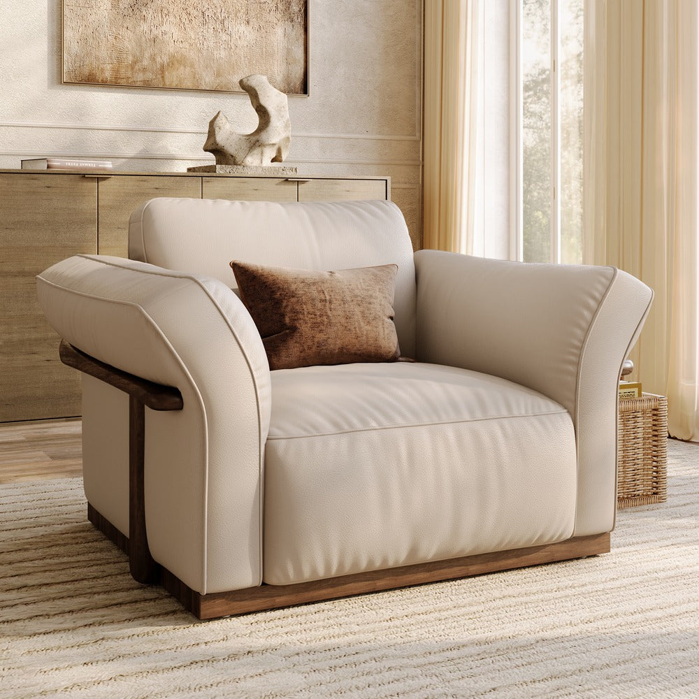 Beige top-grain leather accent chair with solid wood frame in a living room