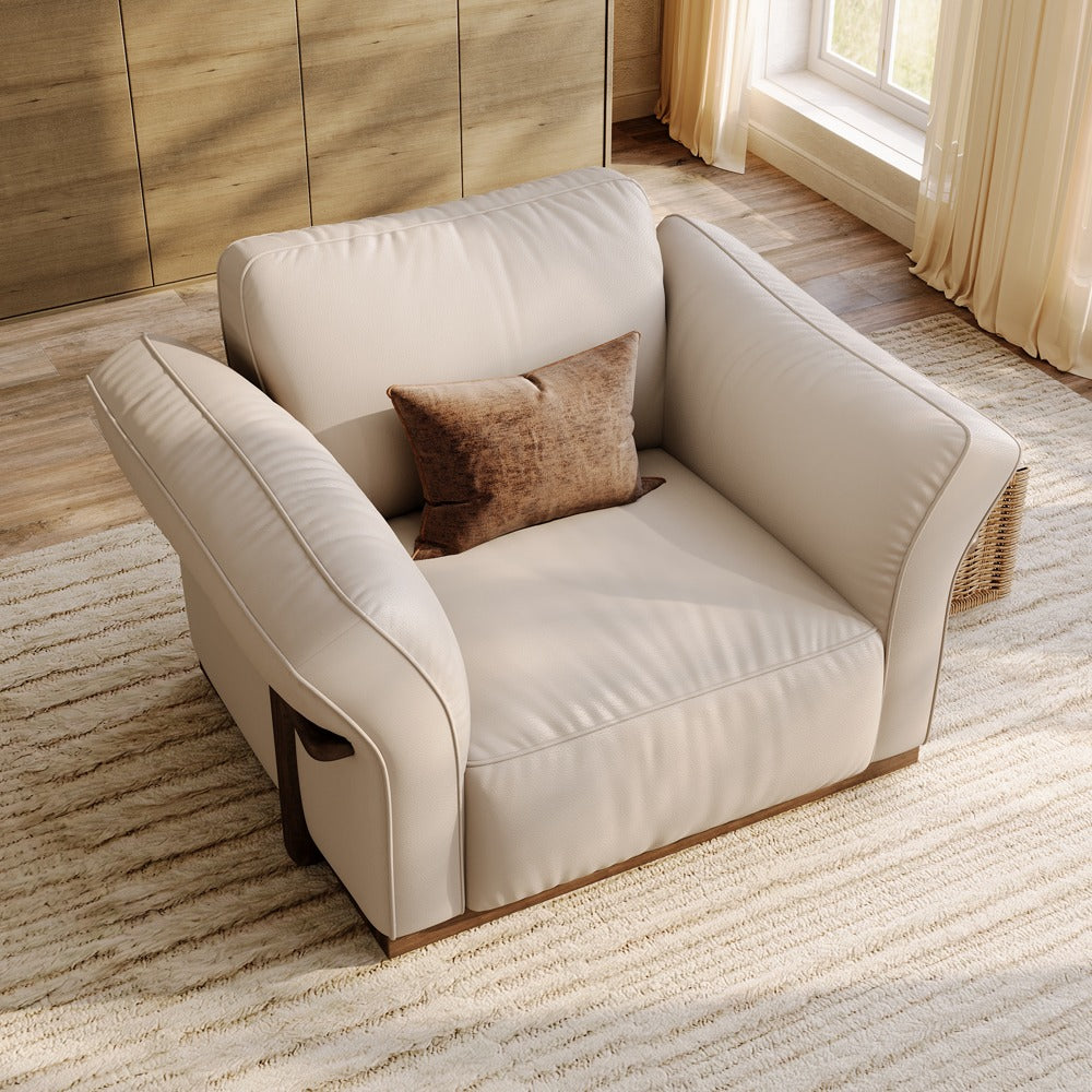 Beige leather accent chair, angled view showing the curved armrests