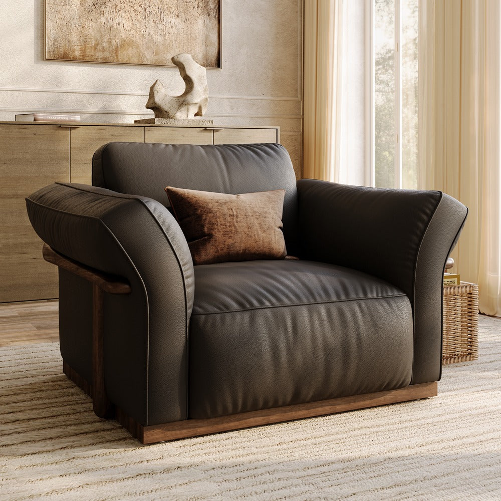 Black top-grain leather accent chair with solid wood frame in a living room