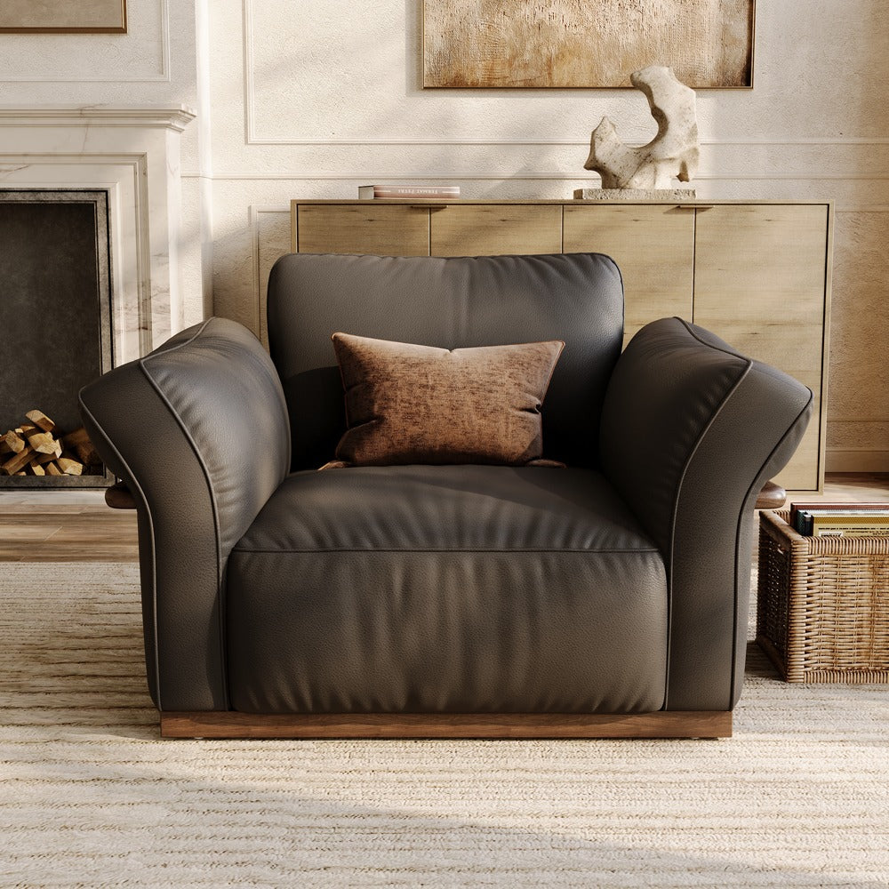 Black leather accent chair, front view in a living room