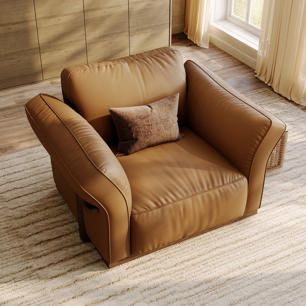 Brown leather accent chair, angled view showing the curved armrests