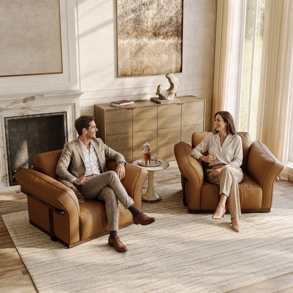 Brown leather accent chairs shown as a pair in a living room (each chair sold individually)