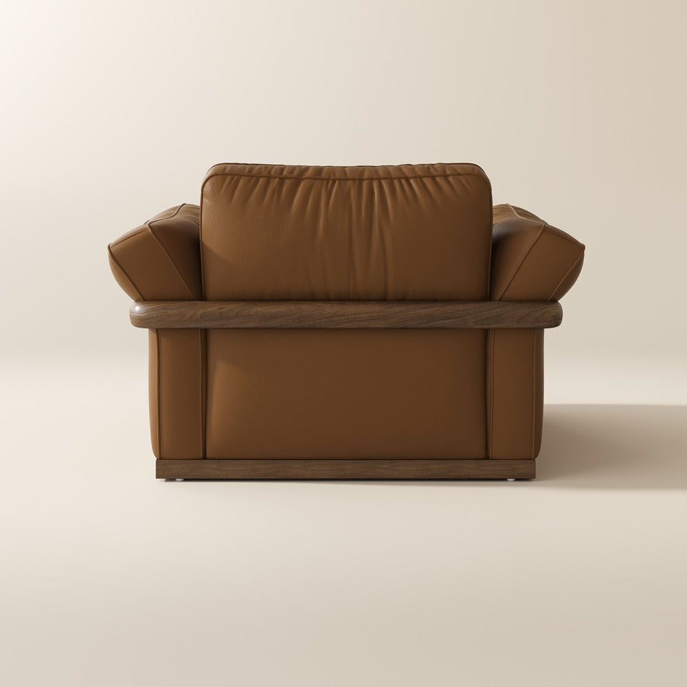 Brown leather accent chair, back view showing the solid wood frame