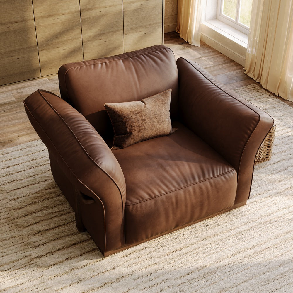 Dark Brown leather accent chair, angled view showing the curved armrests