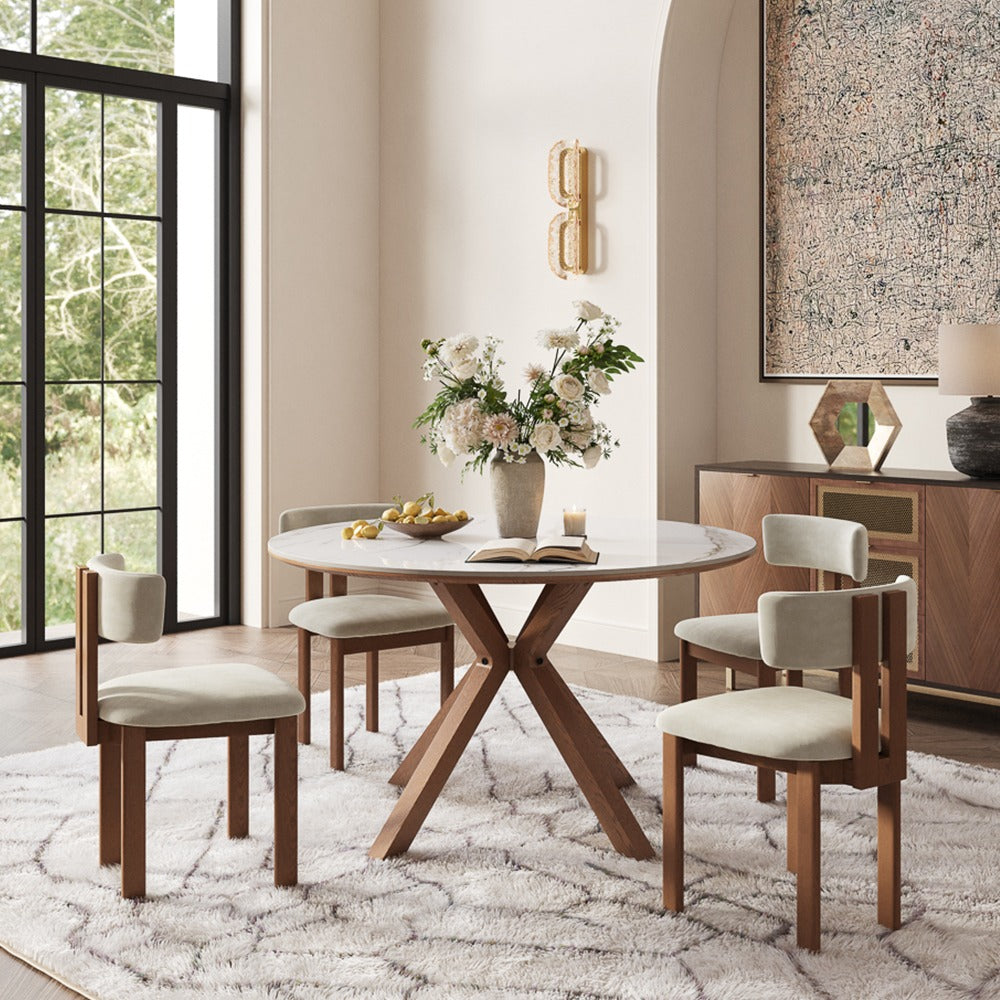 47-inch round white dining table set for four in a bright room