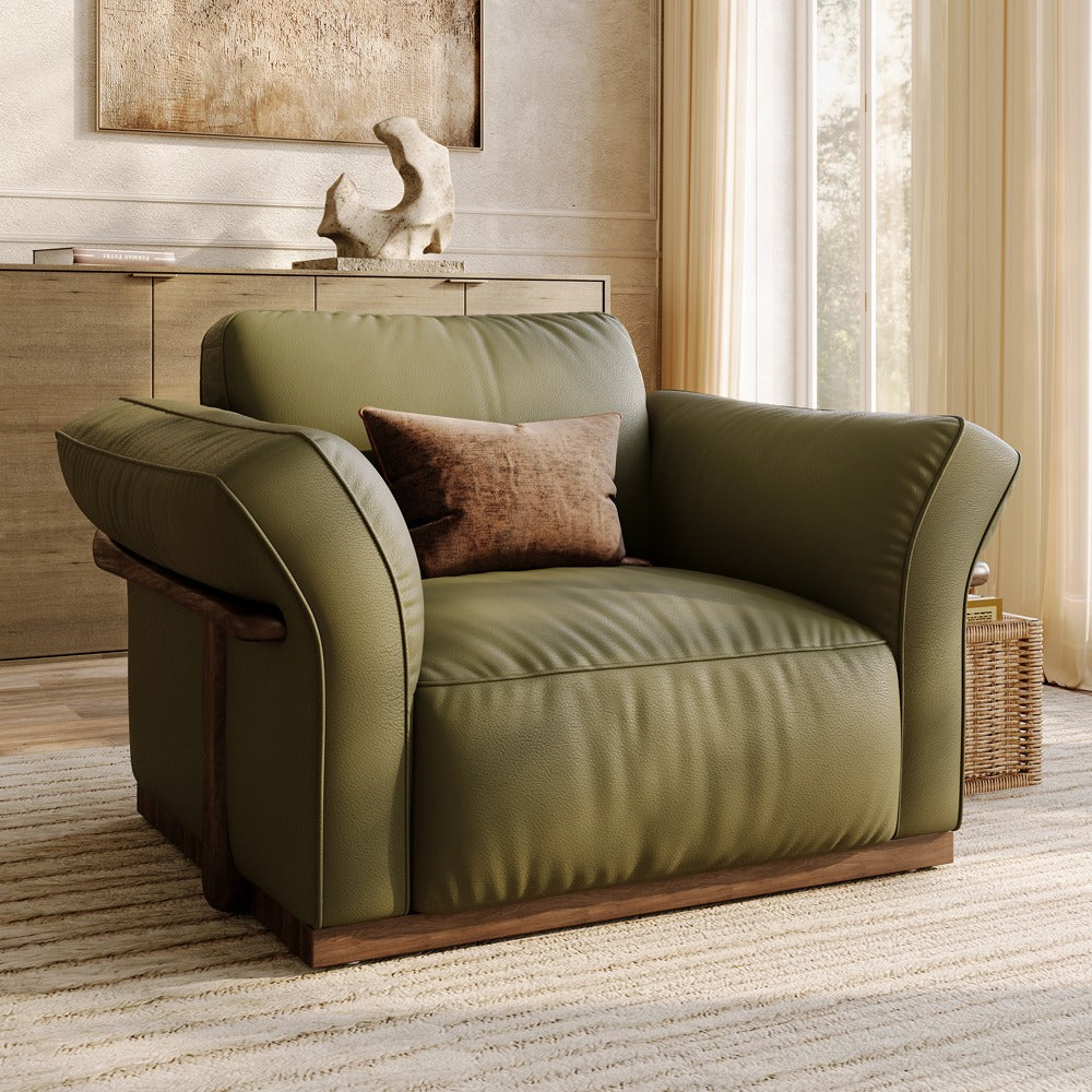 Green top-grain leather accent chair with solid wood frame in a living room