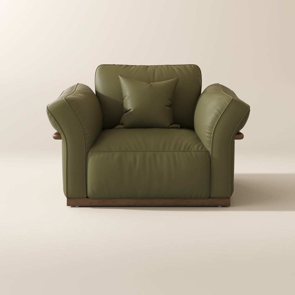 Green top-grain leather accent chair, front view on a plain background