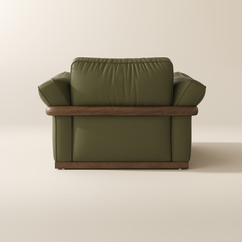 Green leather accent chair, back view showing the solid wood frame
