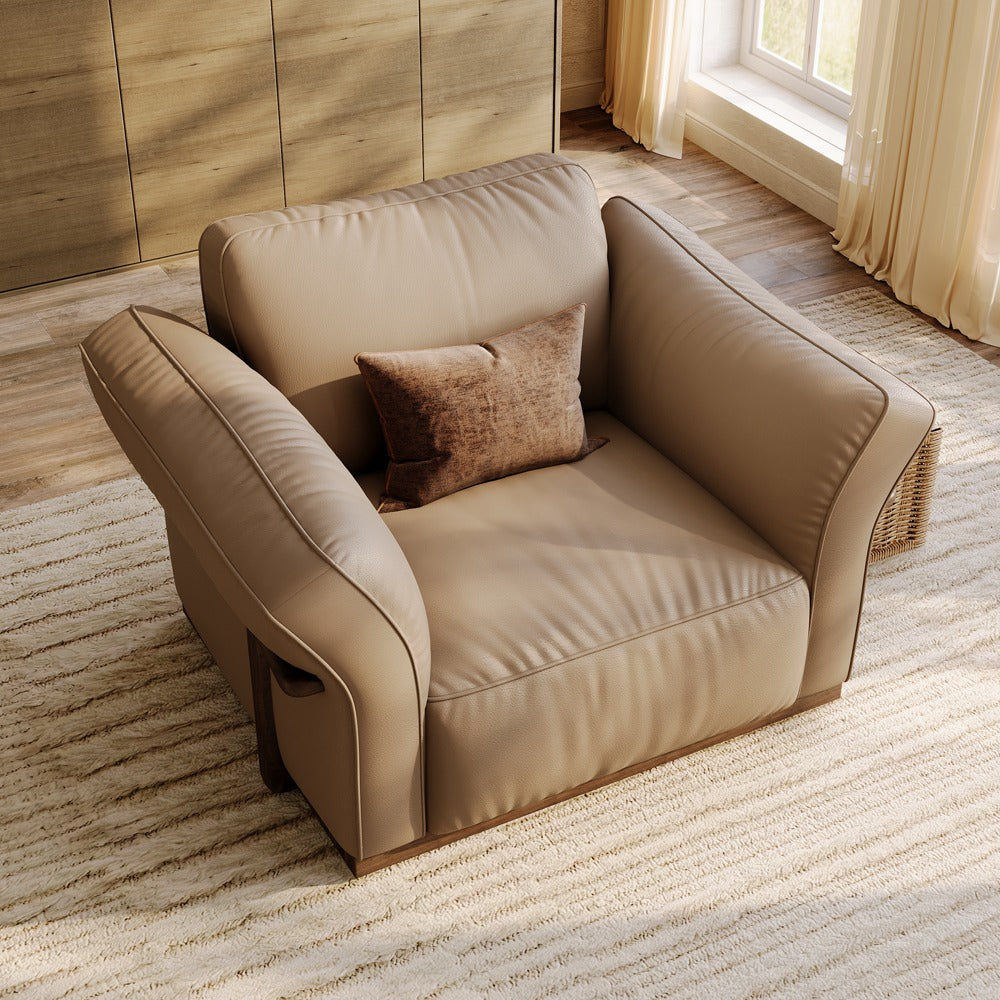 Khaki leather accent chair, angled view showing the curved armrests