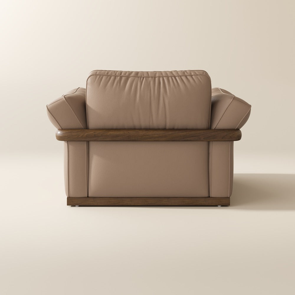 Khaki leather accent chair, back view showing the solid wood frame