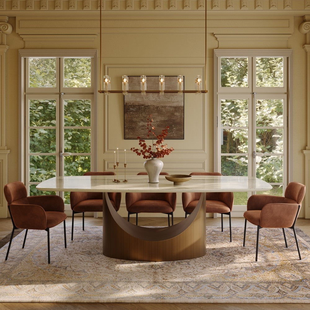 Yellow marble rectangular dining table with bronze arch base, front view in a dining room (chairs not included)