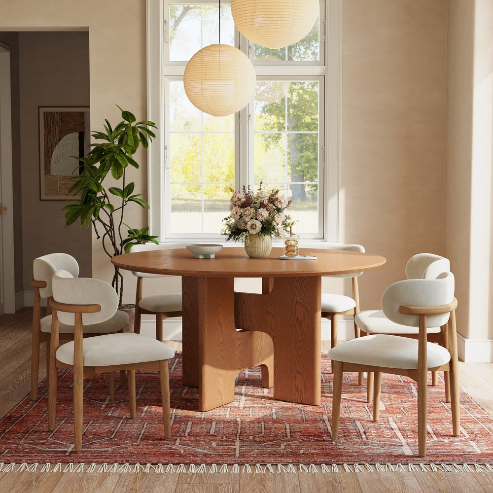 59" round walnut-color wood dining table with double-H pedestal base in a dining room (chairs not included)