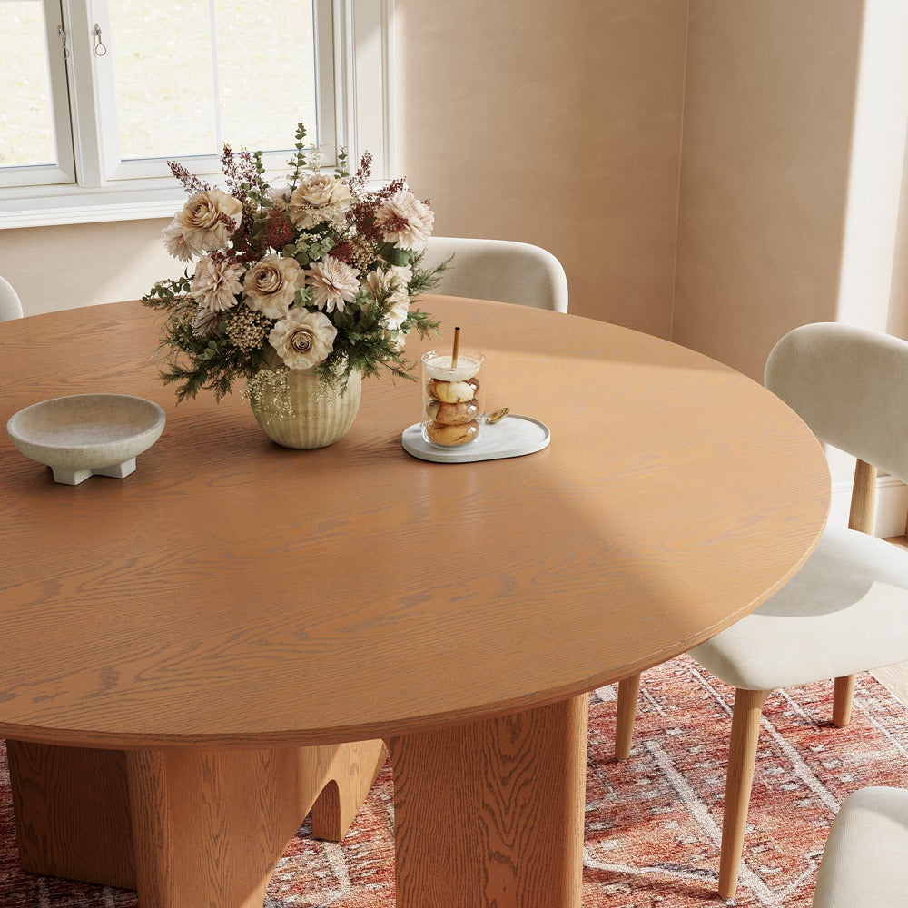 Close-up of round walnut-color tabletop with natural wood grain