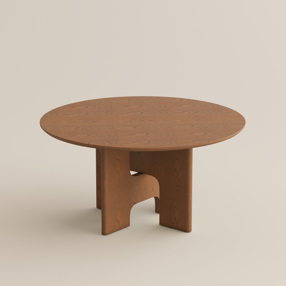59" round walnut-color wood dining table, studio view