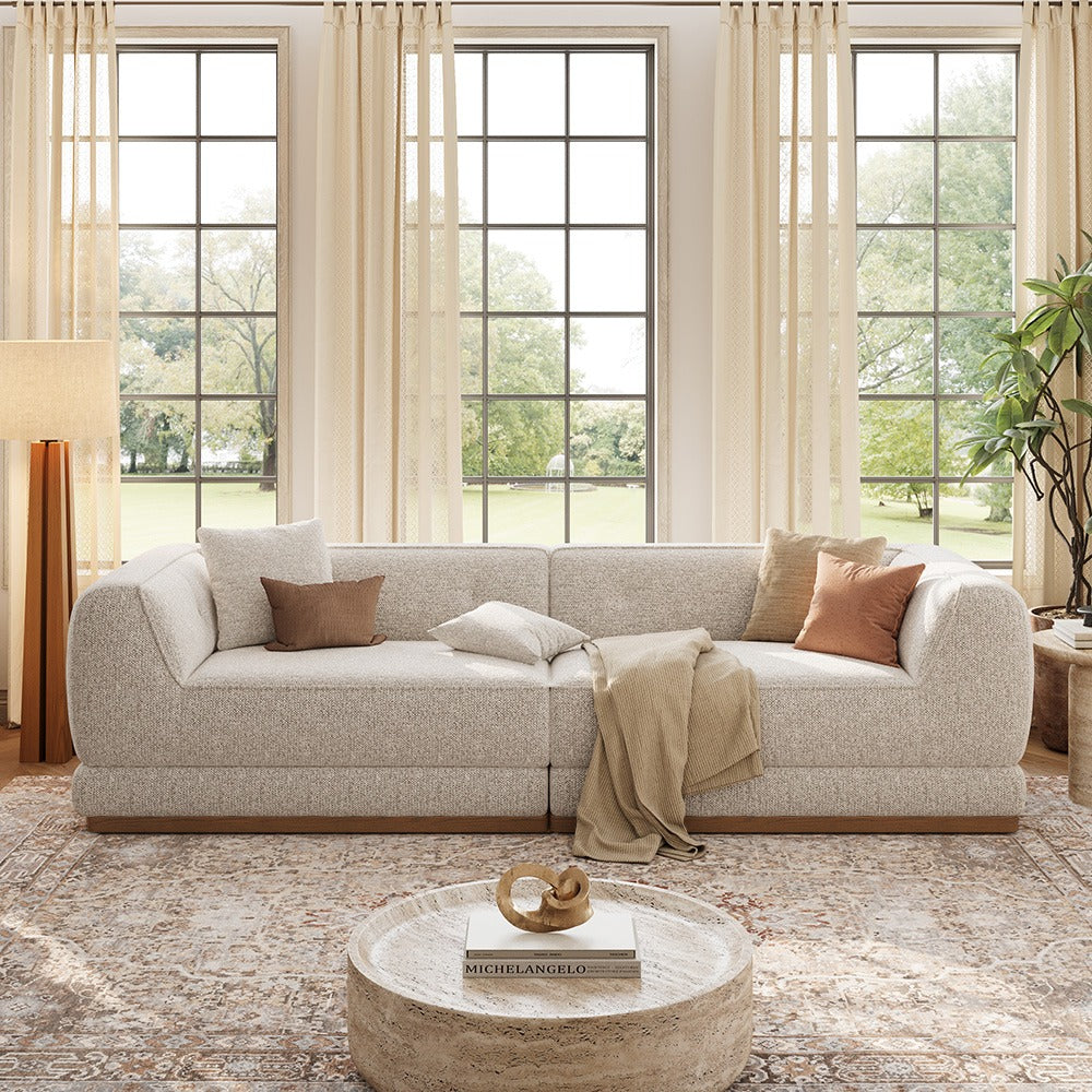 Light gray 110-inch chenille sofa, front view in a living room