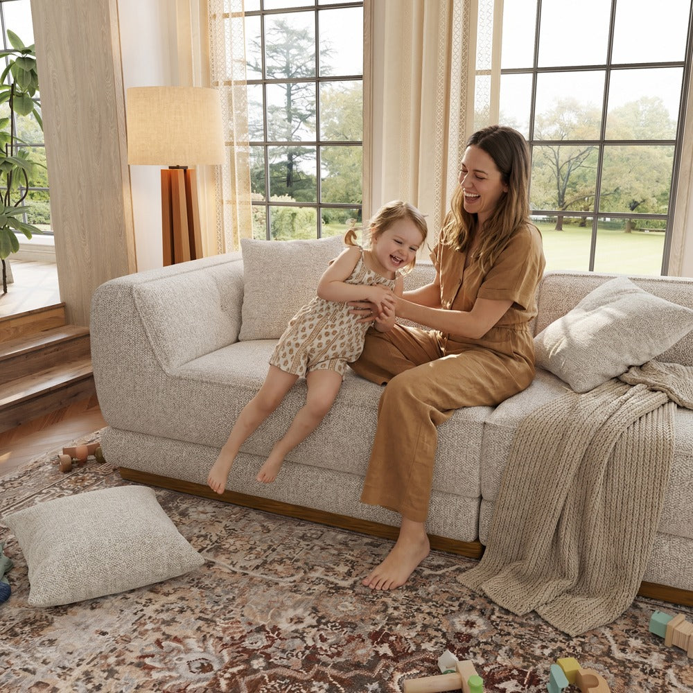 Light gray chenille sofa with deep seats in a family living room