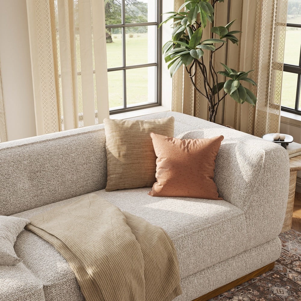 Light gray chenille sofa armrest and seat detail