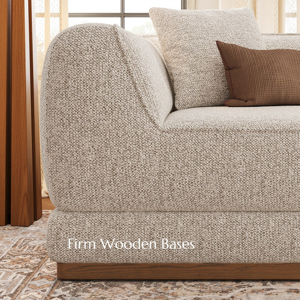 Close-up of the solid wood base on a light gray chenille sofa