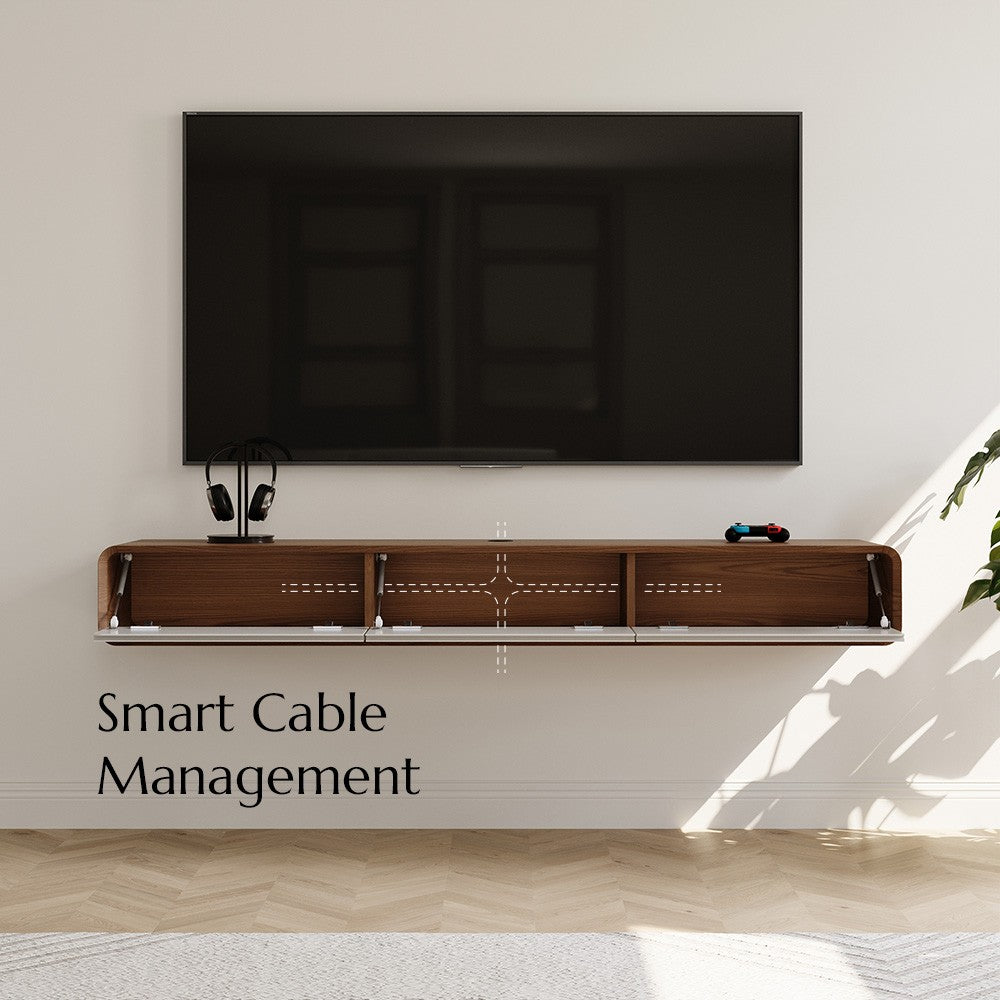 Floating TV stand with cable management under a wall-mounted TV